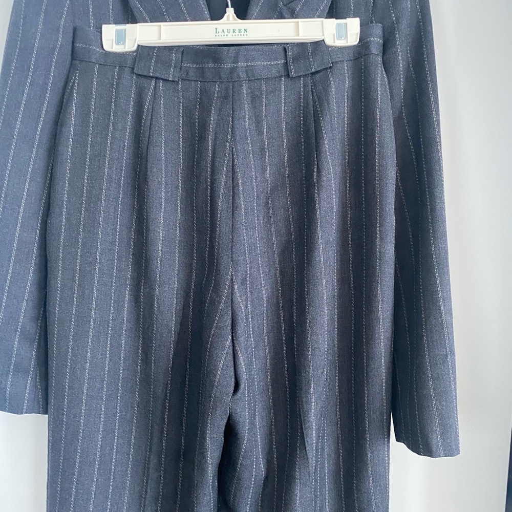 Jones New York pants with pleats and cuffs
Grey pin striped size 12